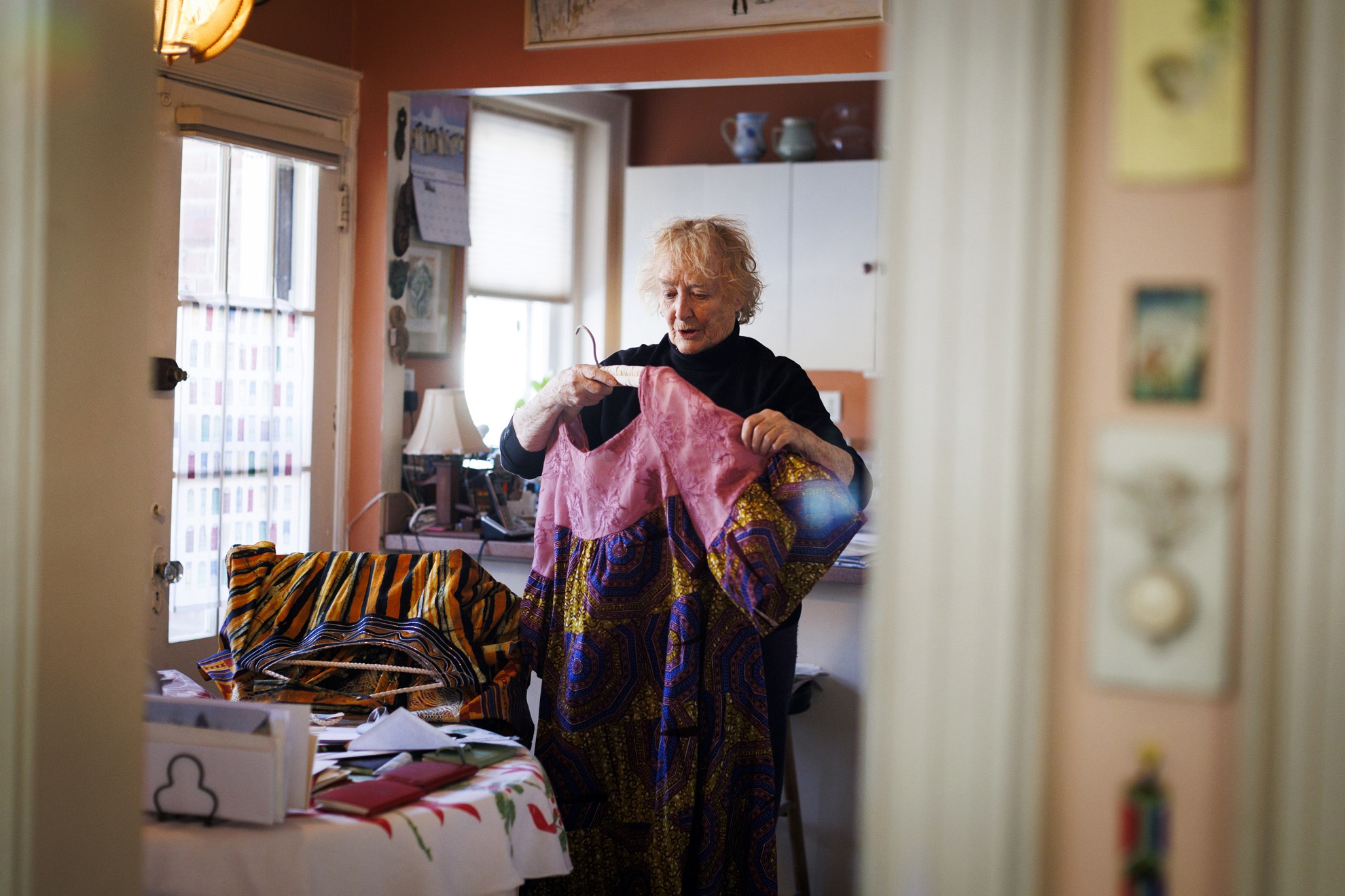 Diane discusses her attire from Ghana in her residence in Brookline.