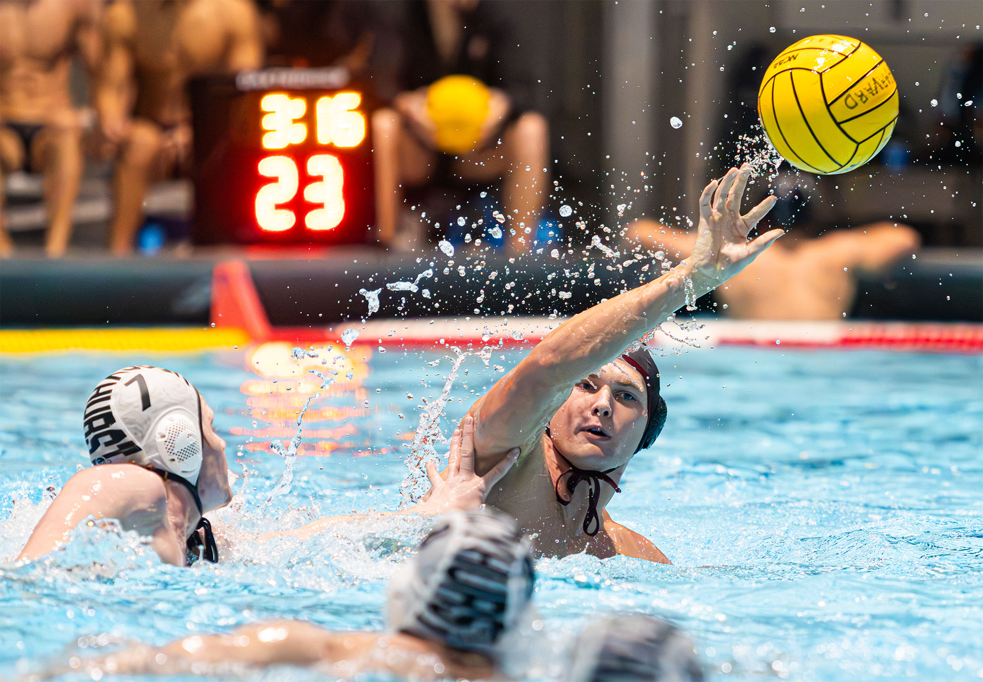 Bradford Dickson participating in a match with the Harvard water polo team.