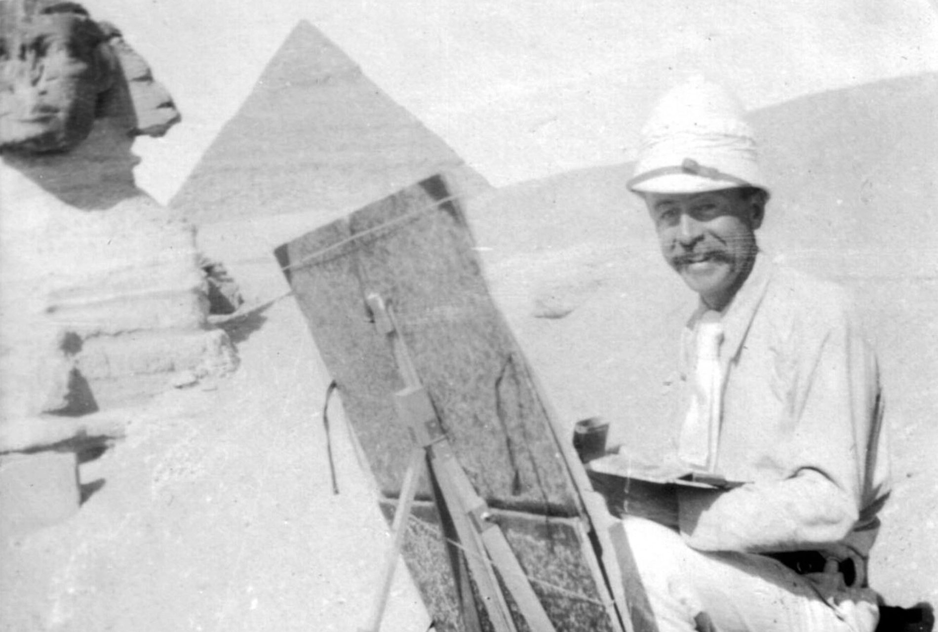 Undated image of Joseph Lindon Smith painting near the Sphinx at Giza, facing west. Courtesy of the Dublin Historical Society.