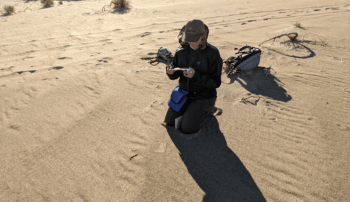 Berger gathers grain-size samples of sand outside the Algodones Dune Field in California.