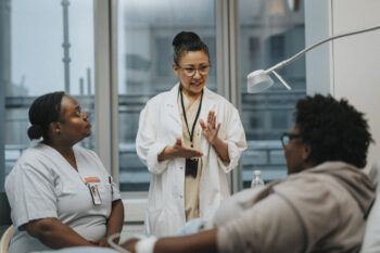 a physician conversing with a patient