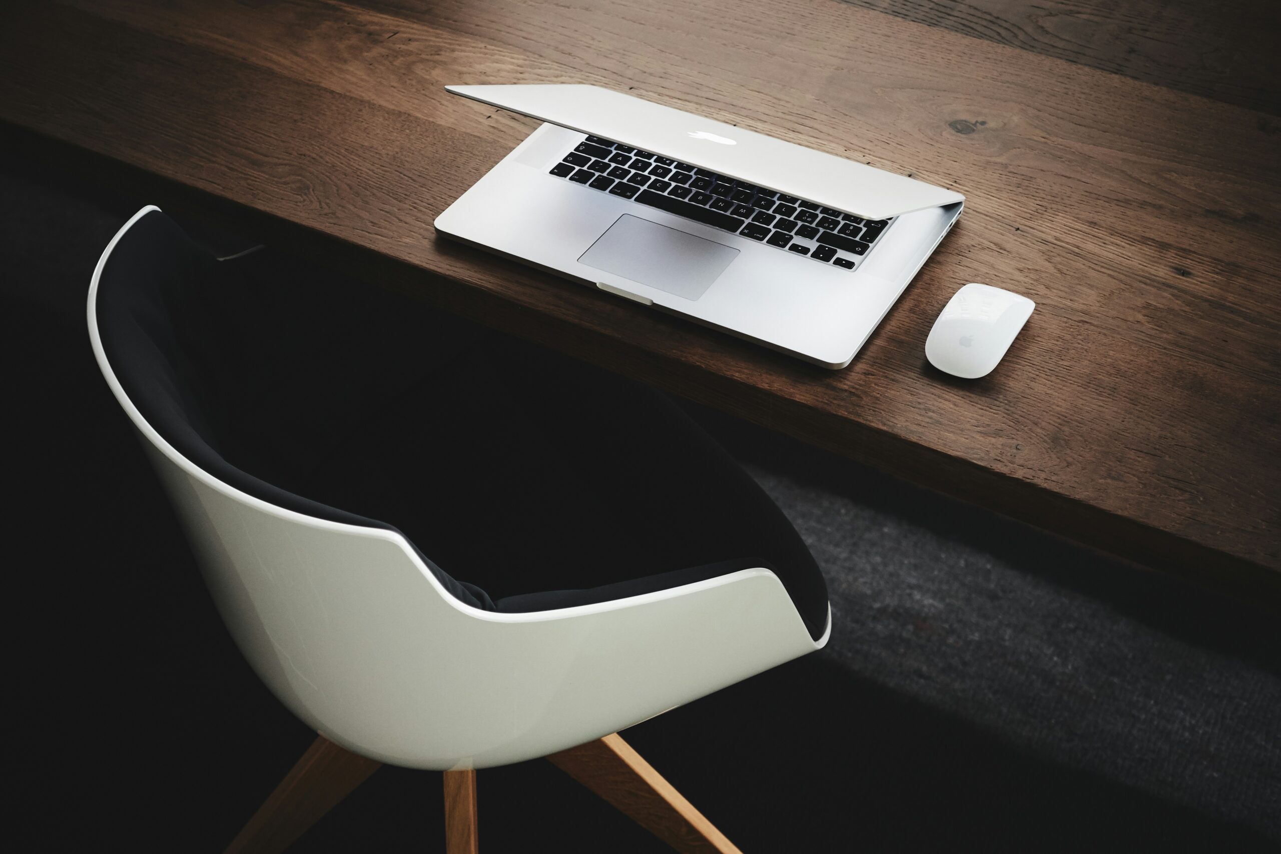 a computer is placed on a wooden table