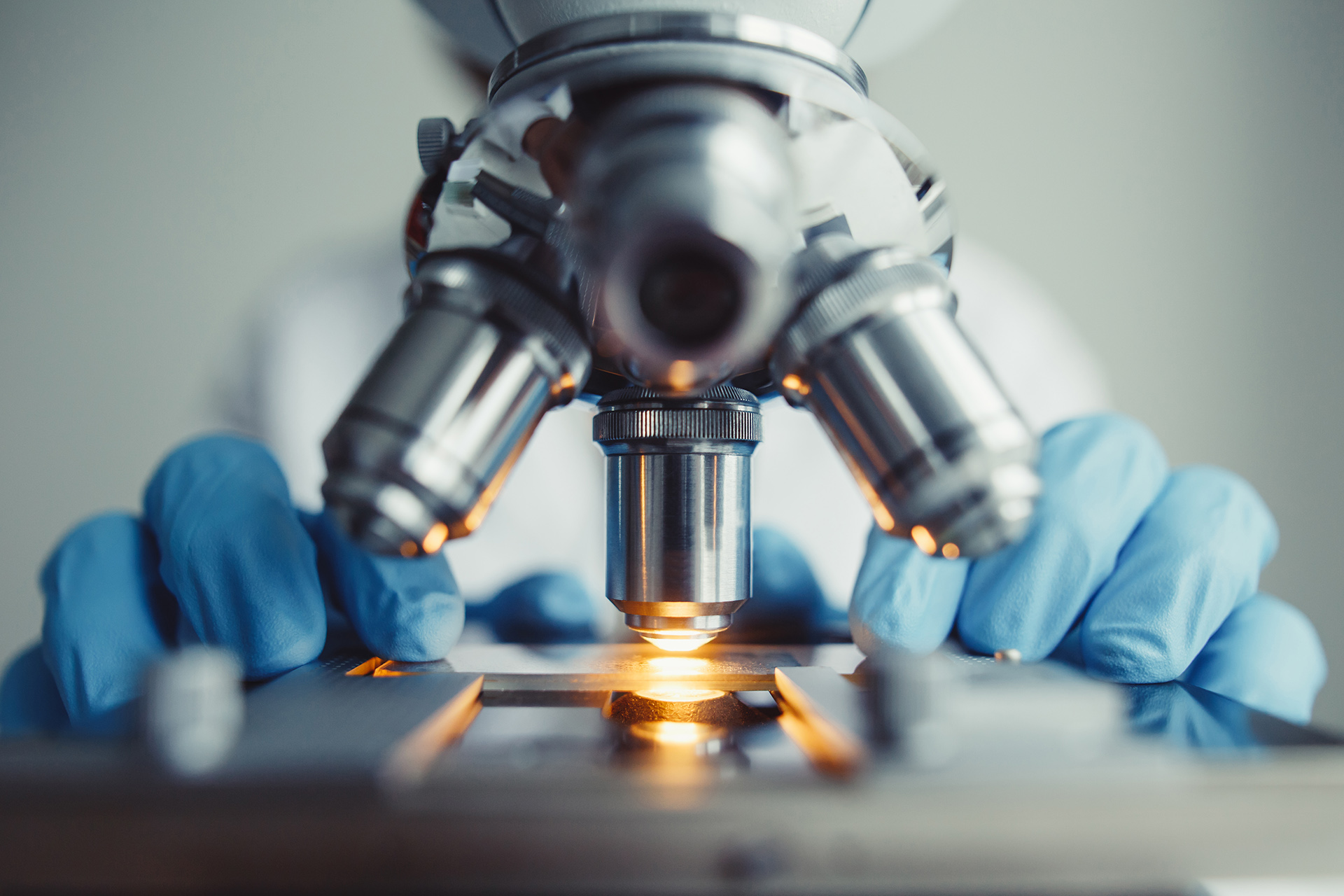 Close-up of microscope within a laboratory.