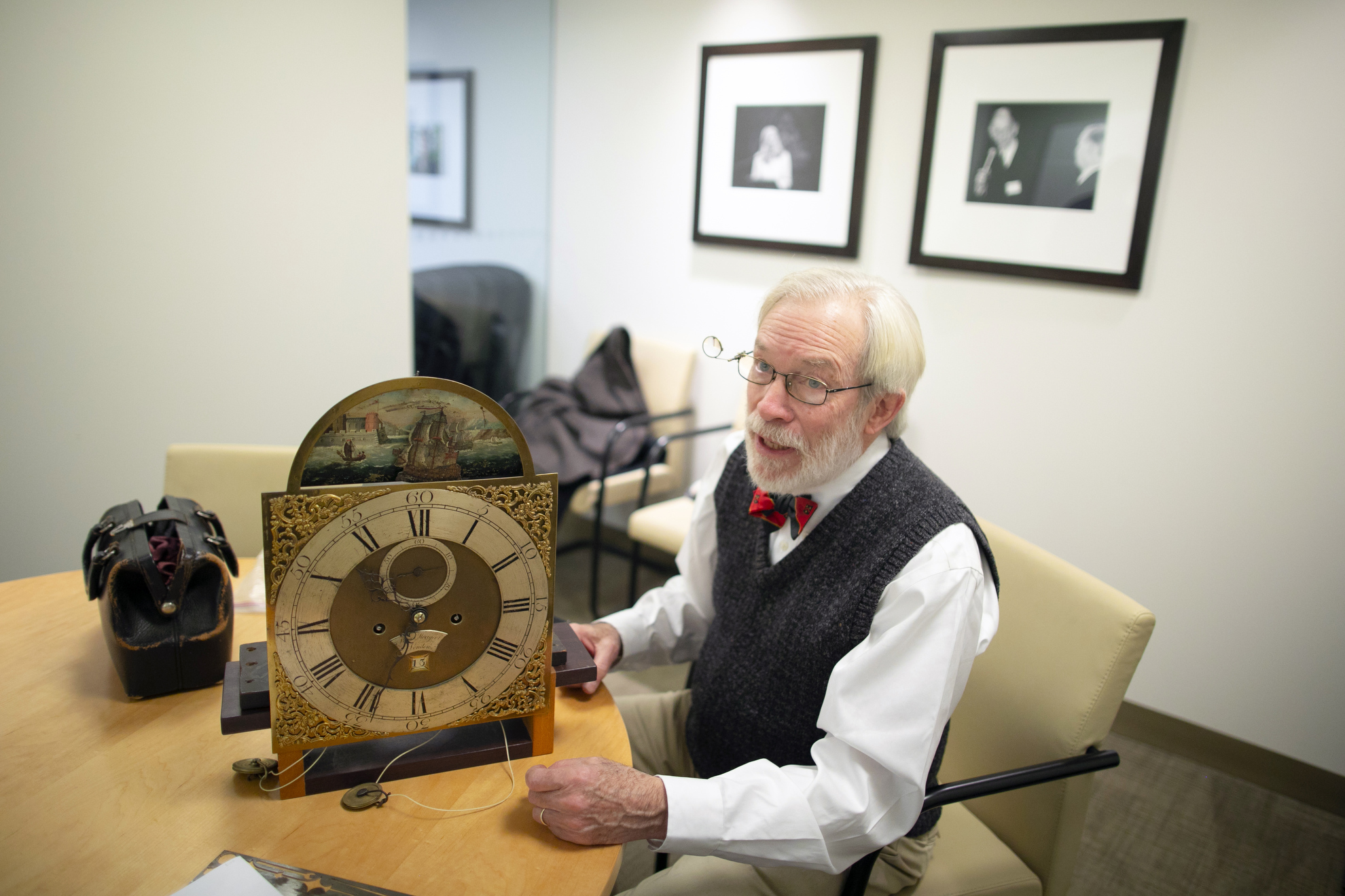 Richard Ketchen, who cares for and maintains Harvard's clocks, is seen working on a clock at the Graduate School of Arts and Sciences.