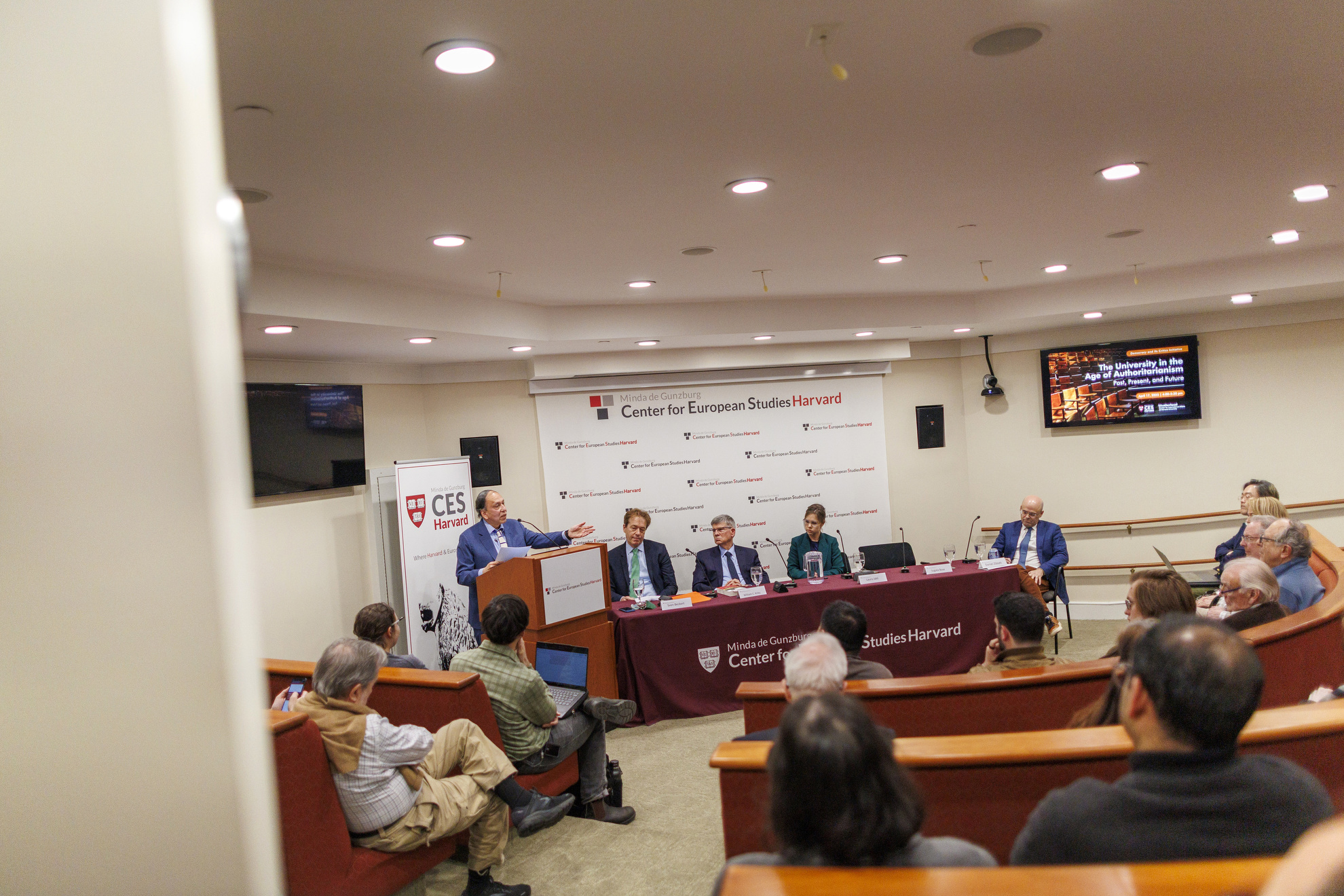 The panel gathered around a table.