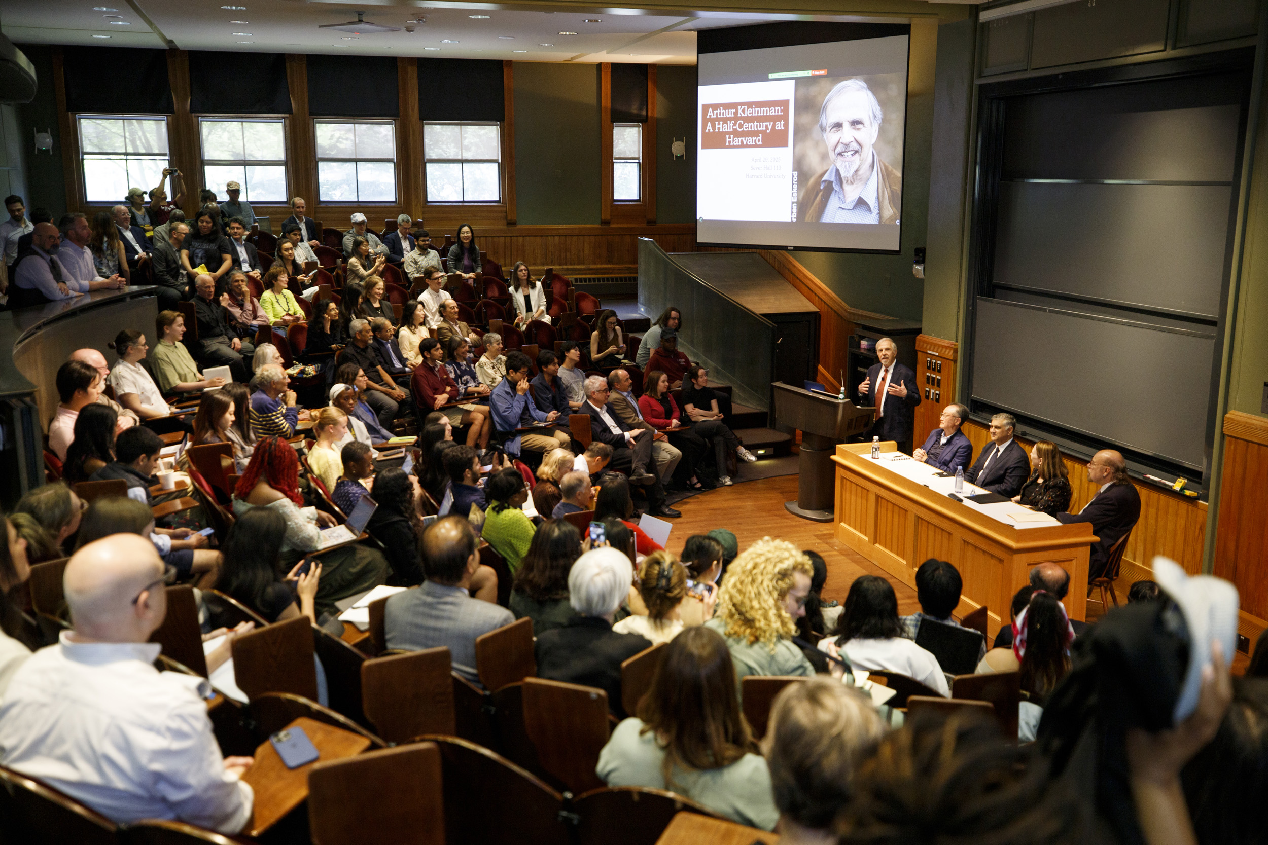 The meeting gathered nearly 200 current and former students at Sever Hall.