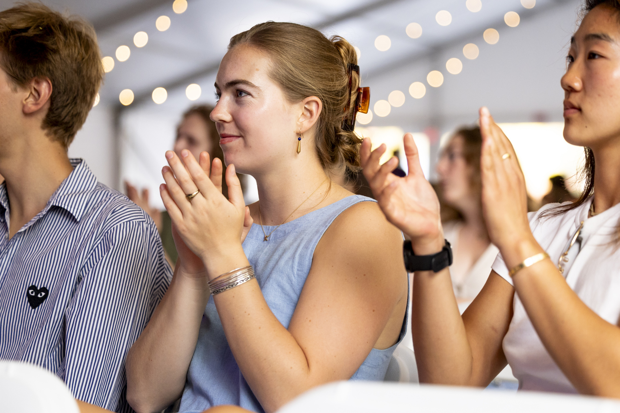 Paton Roberts '25 applauds during the Charles Revival and Friends performance at the Science Center Plaza tent.