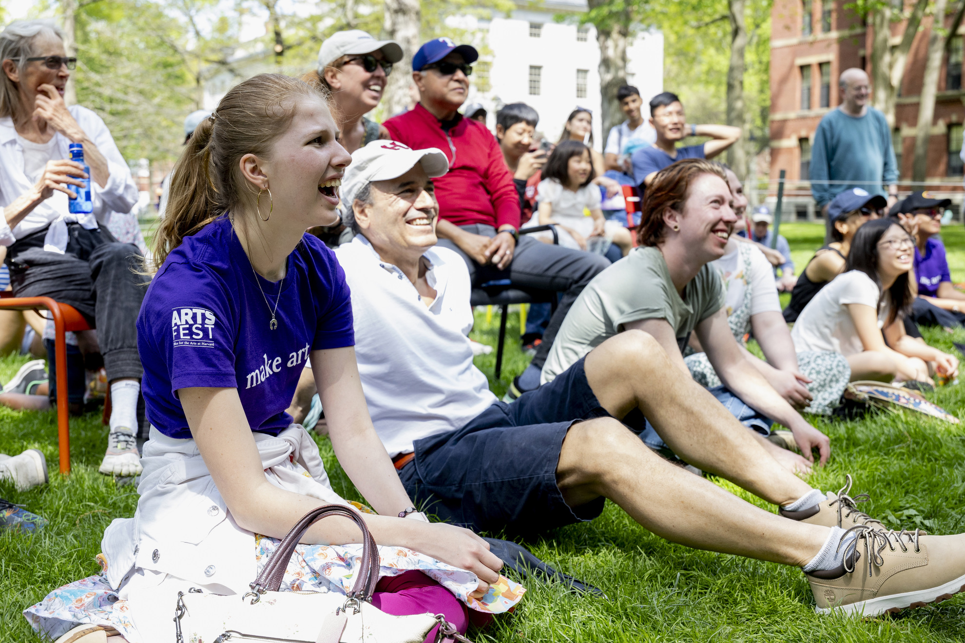 Nathalie Beerelq (left) observes the Three Letter Acronym (TLA) Improv group in Harvard Yard.
