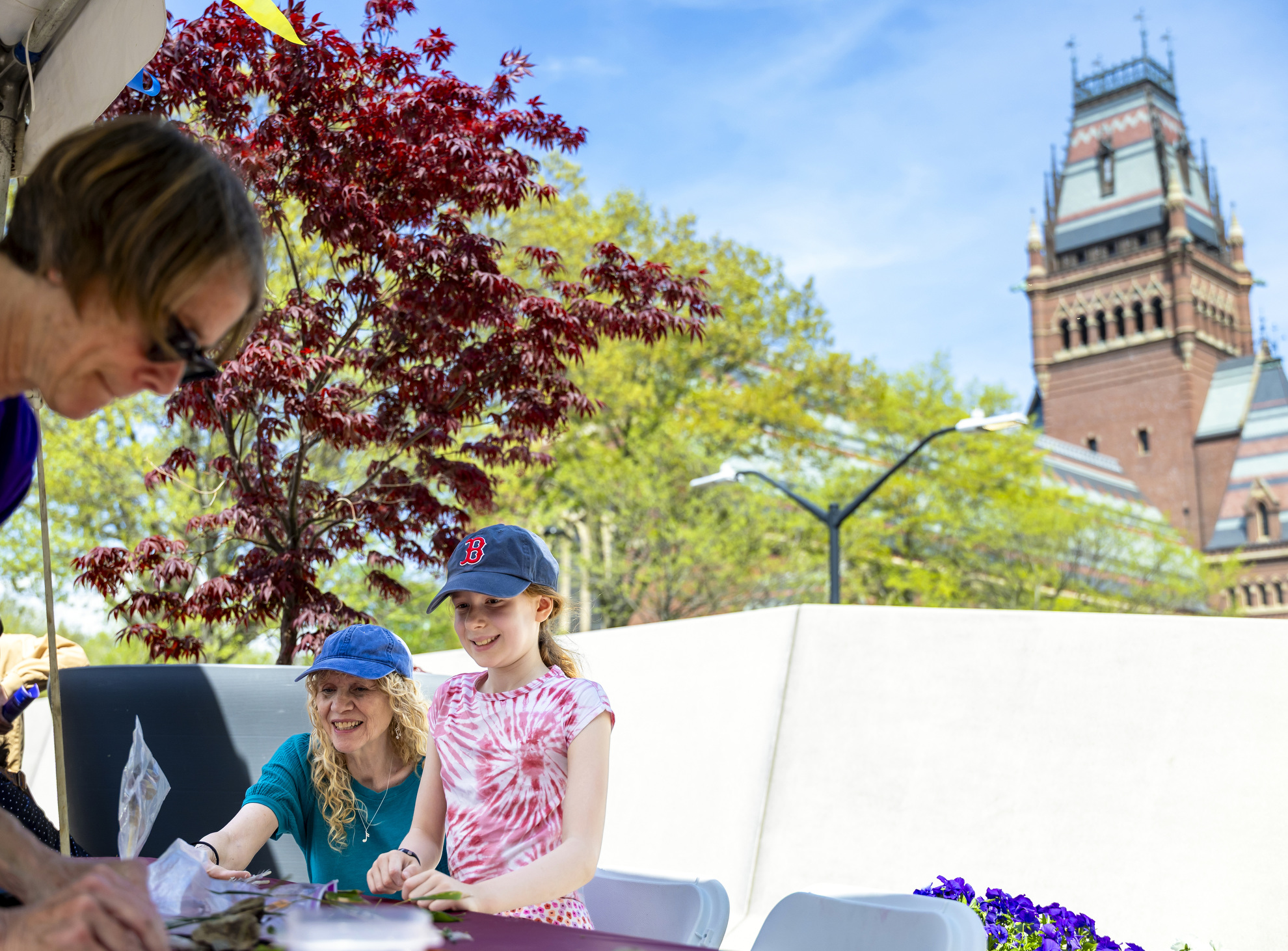Emily Huttin (right) creates a Cyanotype in the Science Center Plaza.