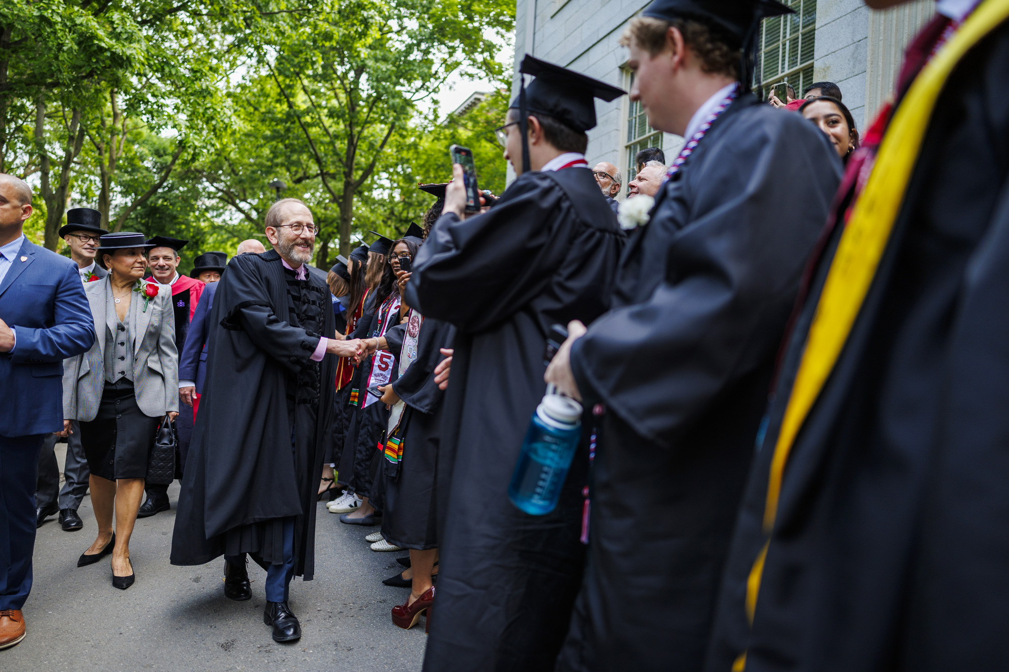 President Alan Garber (center) processes into Tercentenary Theatre.