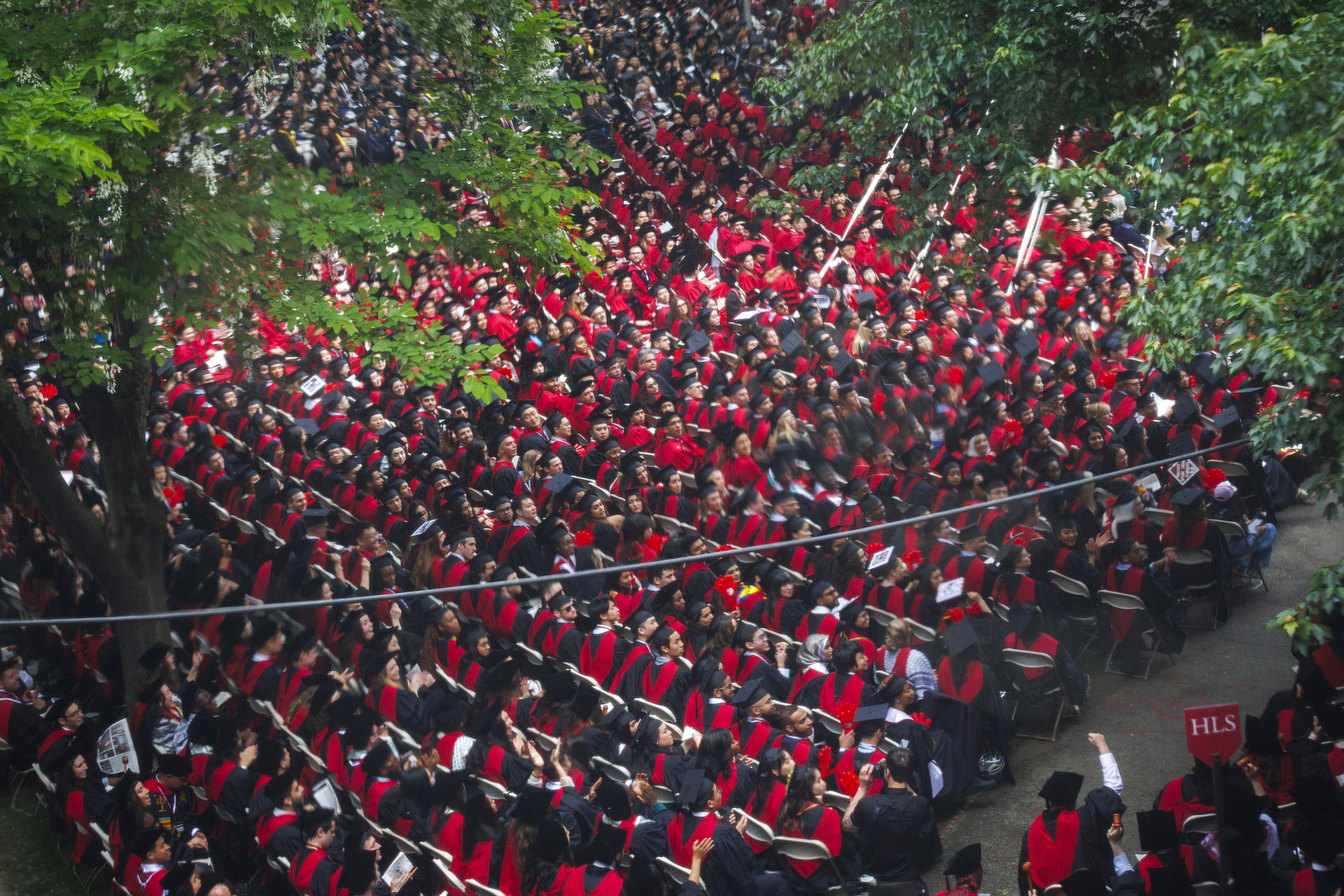 Aerial perspective of graduates in Harvard Yard.