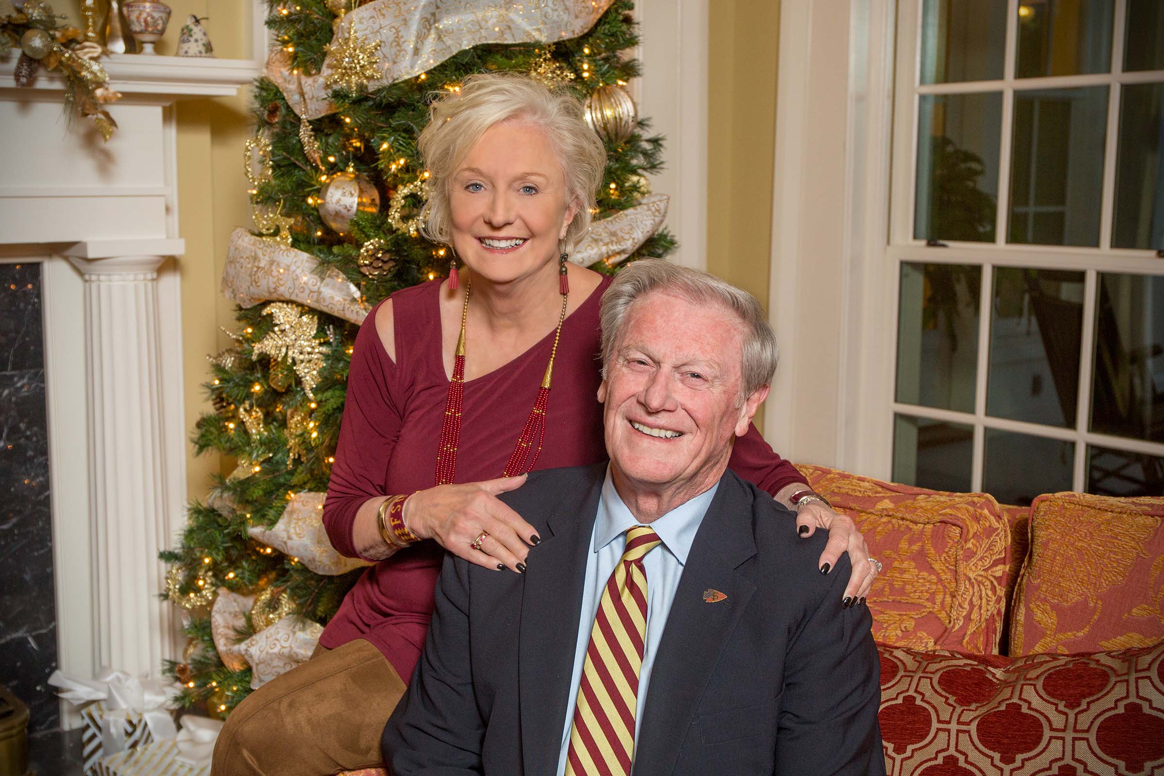 John and Jean Thrasher pose for their annual holiday photo in front of the Christmas tree at the FSU President’s house in December 2017.