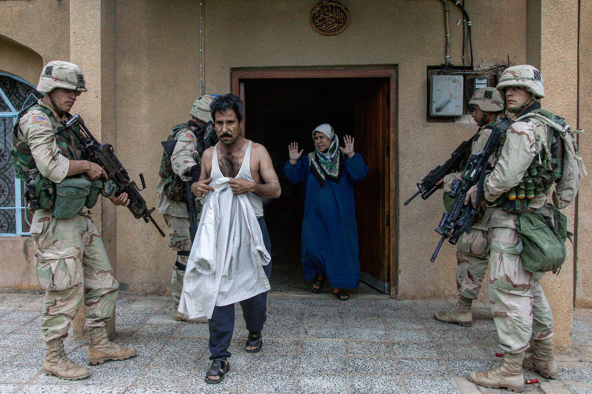 American soldiers conducting a raid at a residence in Baghdad, Iraq in 2003.