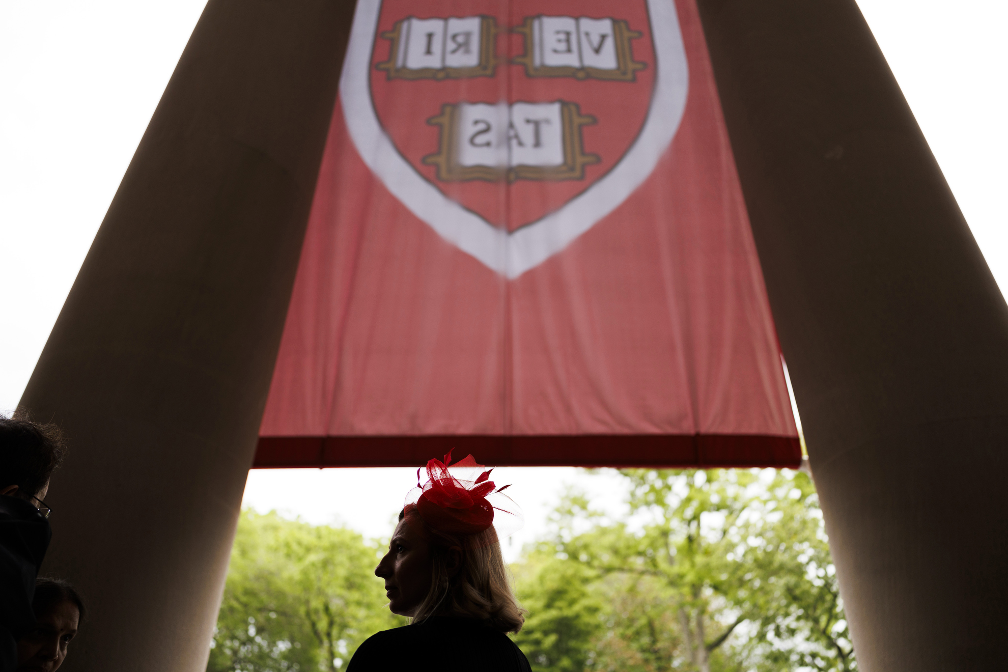 A staff member observes the ceremony.