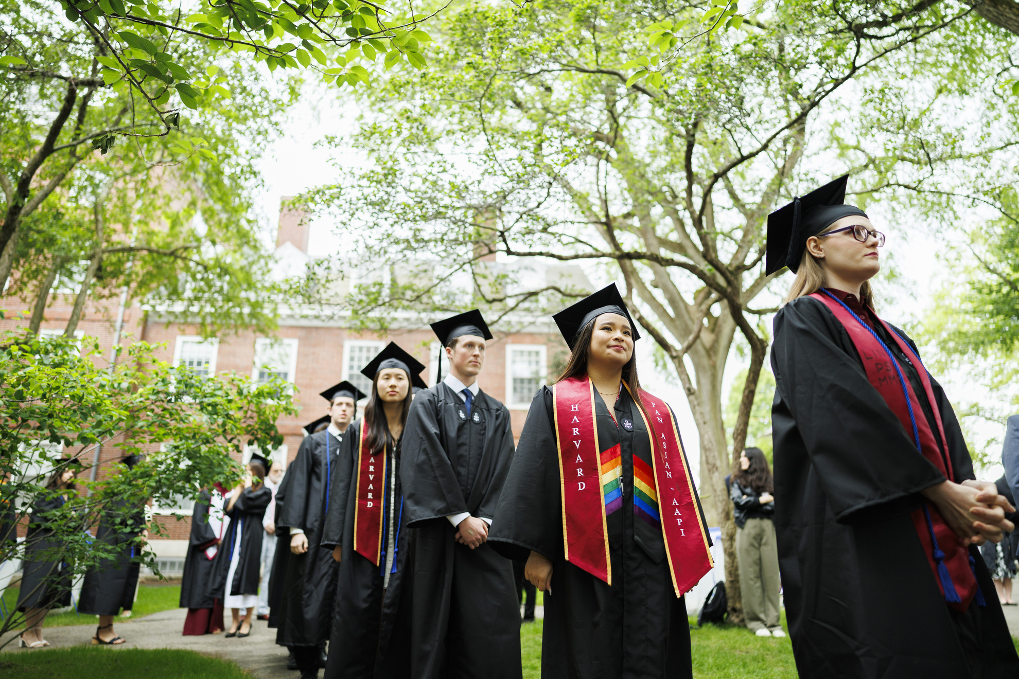 Graduates queue to receive their diplomas.