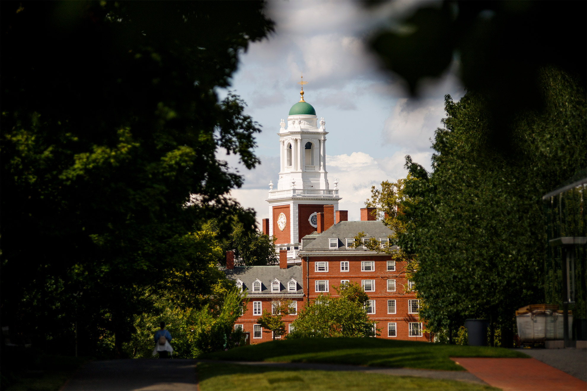 The Eliot House spire is surrounded by foliage.