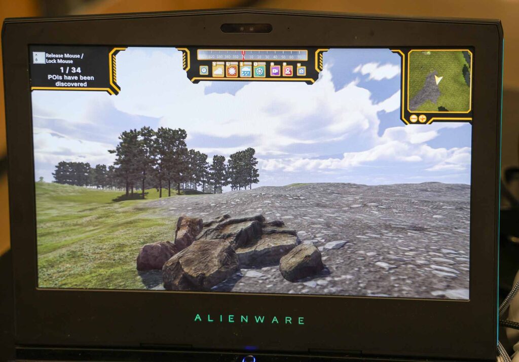 A screen grab of the game students in the class of Alpena High School science teacher Erich Schlueter play. It features artificially intelligent caribou, and using a virtual reality headset and controllers, high school students can follow caribou as they wander the ancient land bridge. Image credit: Jeremy Marble