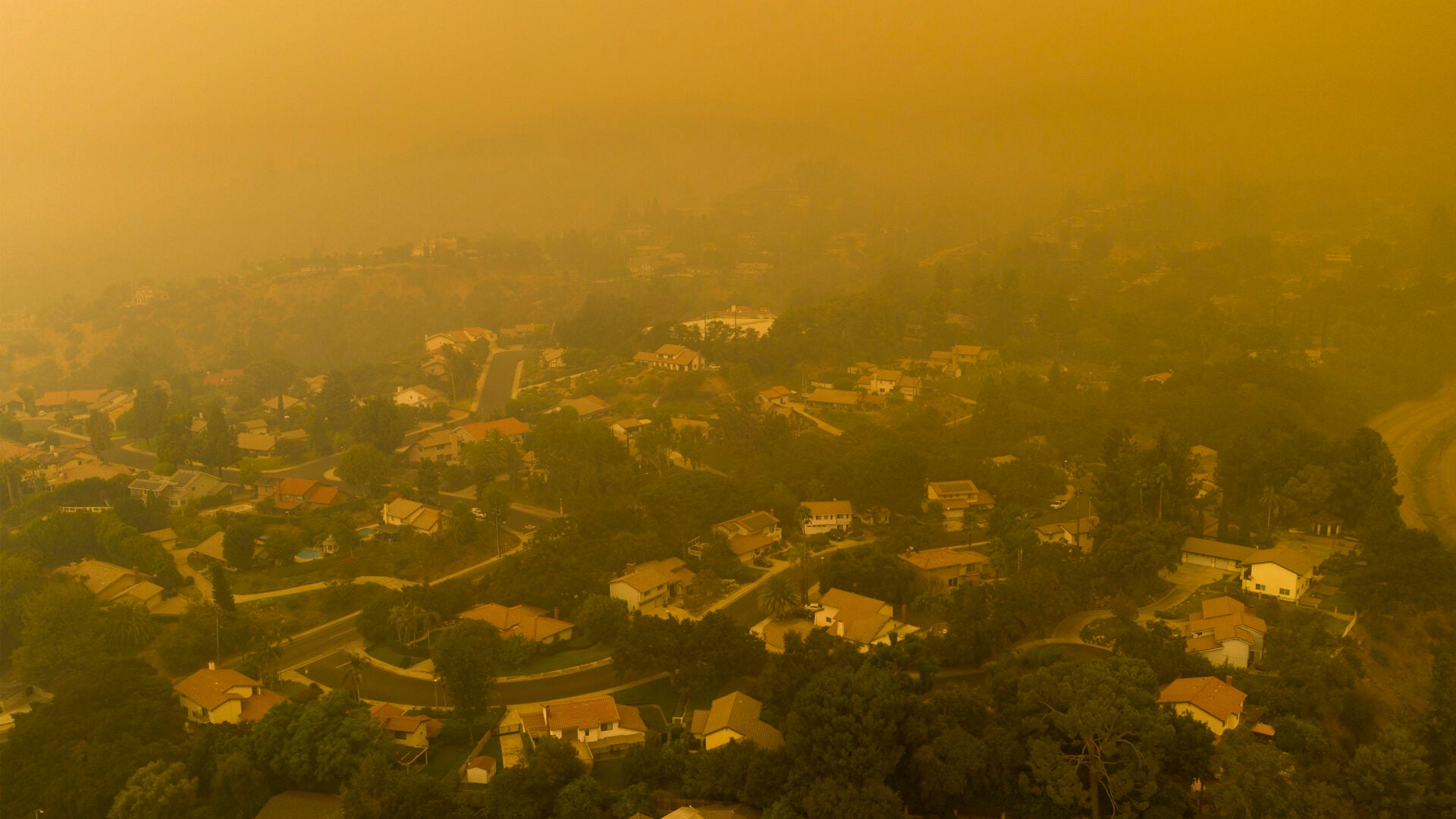 Smoke from Wildfires and Heat Stress Associated with Negative Birth Outcomes