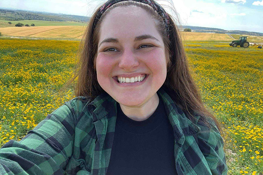 Danielle Wirsansky, a doctoral candidate within the History Department at Florida State University, amidst a field of wildflowers in the Northern region of Israel. For her Fulbright cultural engagement initiative, Wirsansky captured images of wildflowers throughout Israel and developed a virtual exhibition titled “Blooming Against All Odds.” (Danielle Wirsansky)