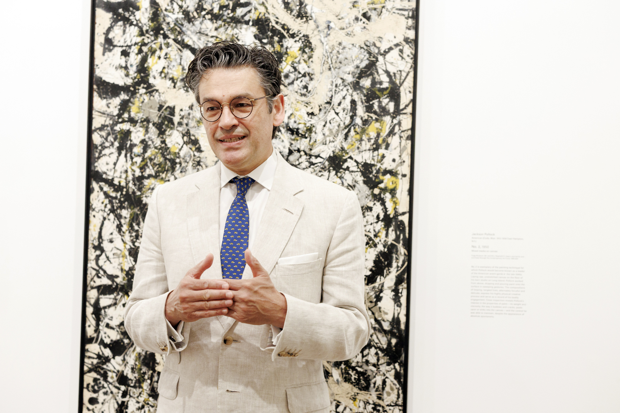 Narayan Khandekar with "No. 2" by Jackson Pollock.