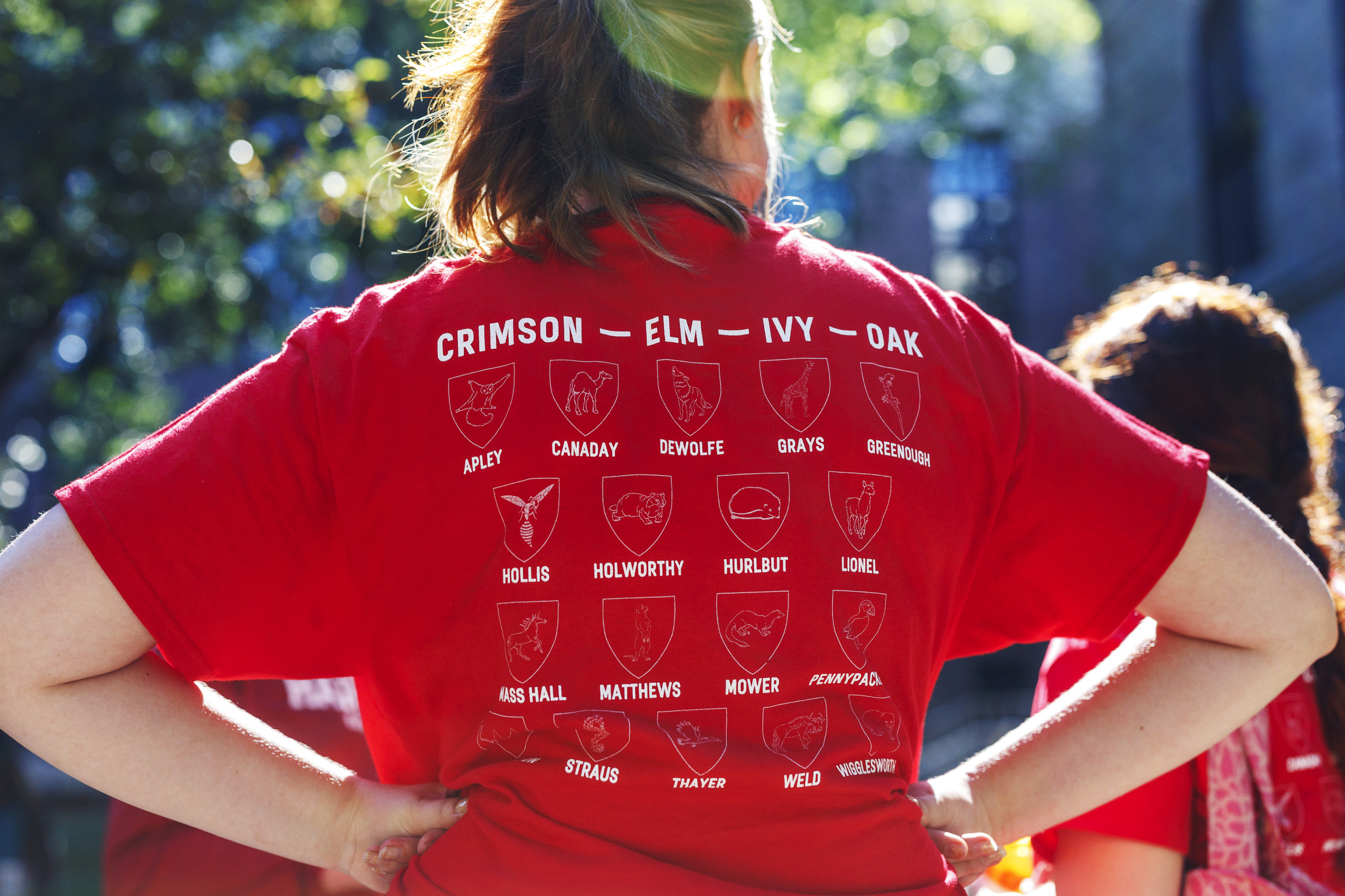 Alex Heuss ’26 dons a T-shirt adorned with all the first-year Houses.
