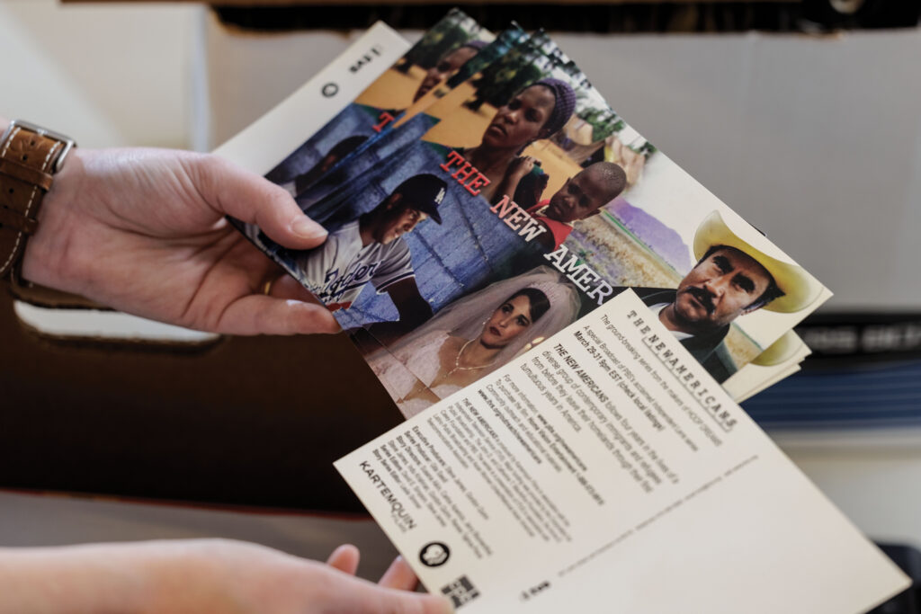 Within the 440 boxes of memorabilia — including film posters, storyboards, promotional images, soundtrack albums, and other unique items created for new film releases — lies background material for the seven-part series <i>The New Americans</i>. (Photo: Whitney Curtis/WashU)” class=”wp-image-710059″ sizes=”(max-width: 1024px) 100vw, 1024px”><figcaption class=