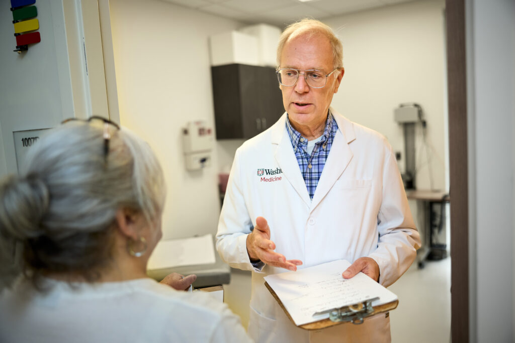 Thomas Bailey, MD (right), professor of medicine and medical director of the St. Louis County Department of Public Health (DPH) TB Program, confers with Tracey Swaringen, the program’s nurse supervisor, at the DPH TB Chest Clinic. (Photos: Matt Miller/WashU Medicine)