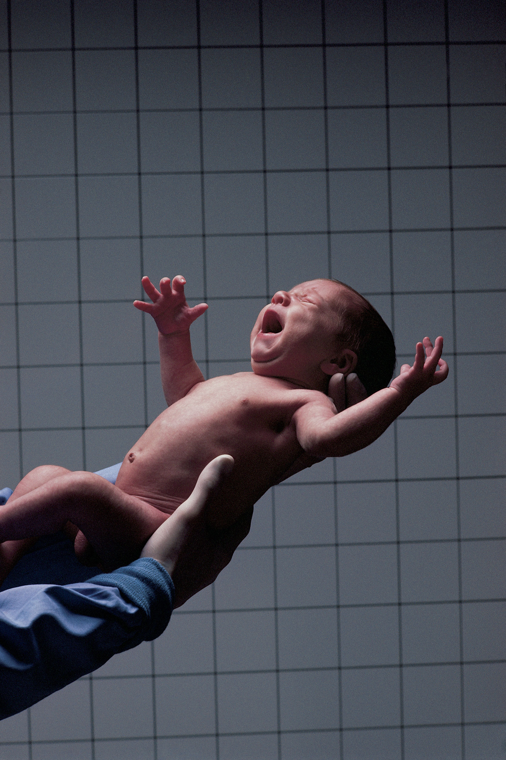 Physician with newborn.