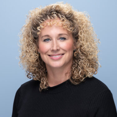 portrait of a woman with curly hair