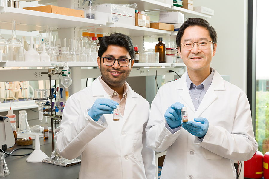 From left, Arijit Ghorai and Ho Yong Chung hold samples of lignin-based polyurethane. The research team utilized lignin and carbon dioxide to develop a novel type of polyurethane that is biodegradable and free from hazardous chemicals. (Scott Holstein/FAMU-FSU College of Engineering)