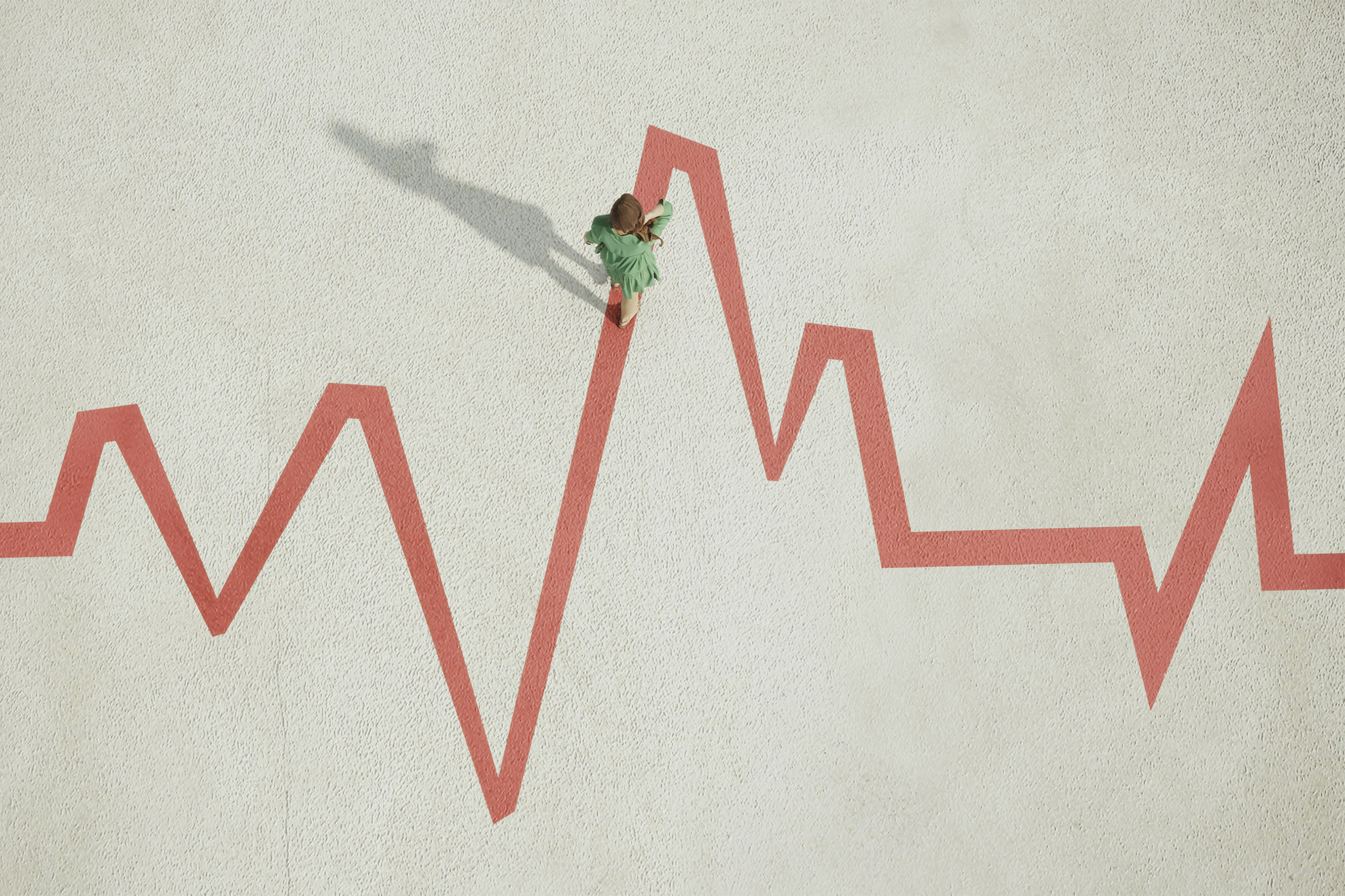 Woman traversing along a pulse trace styled zigzag line.