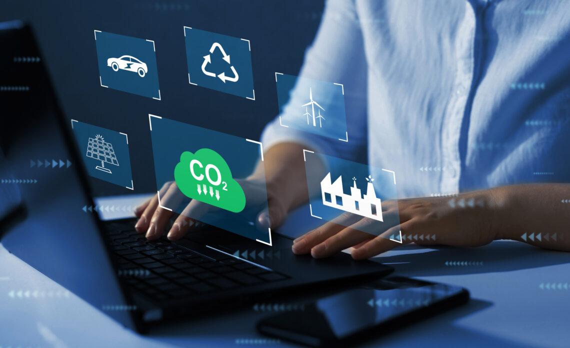 Graphics related to climate overlaying a laptop keyboard.