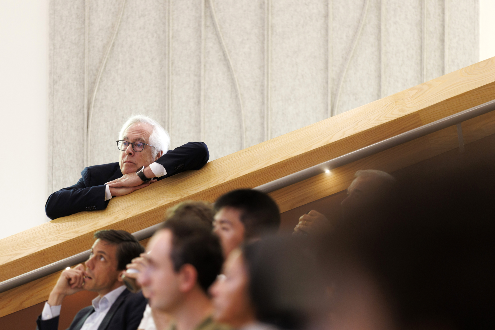Louis Menand (shown) listens attentively to his colleagues as they deliver introductory comments.