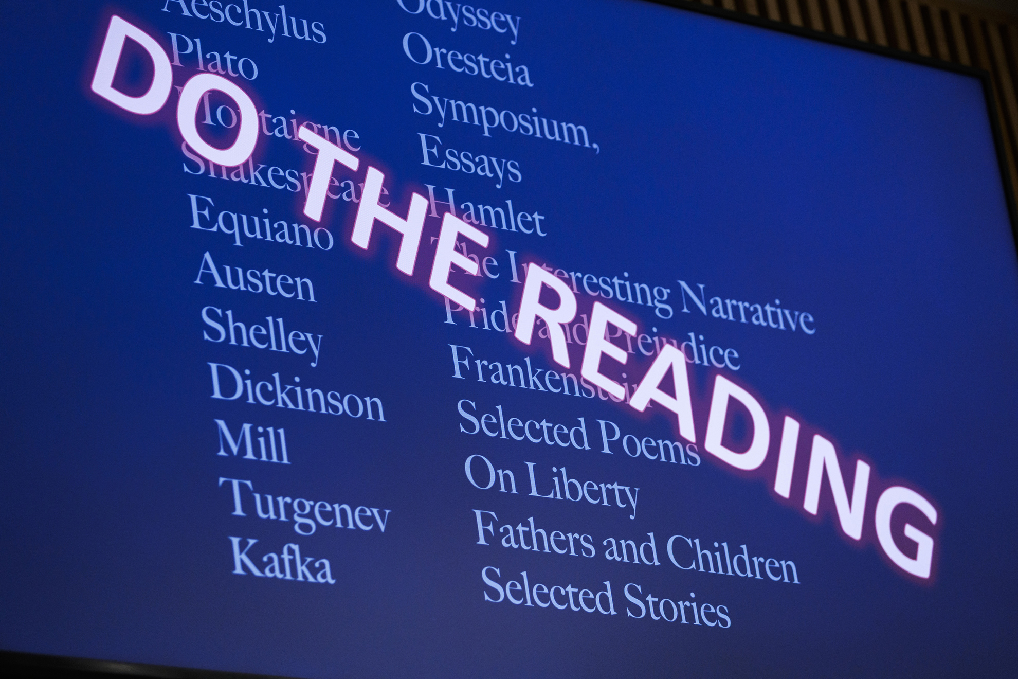 Tara Menon presents a slide during introductory remarks urging the students to “complete the reading.”