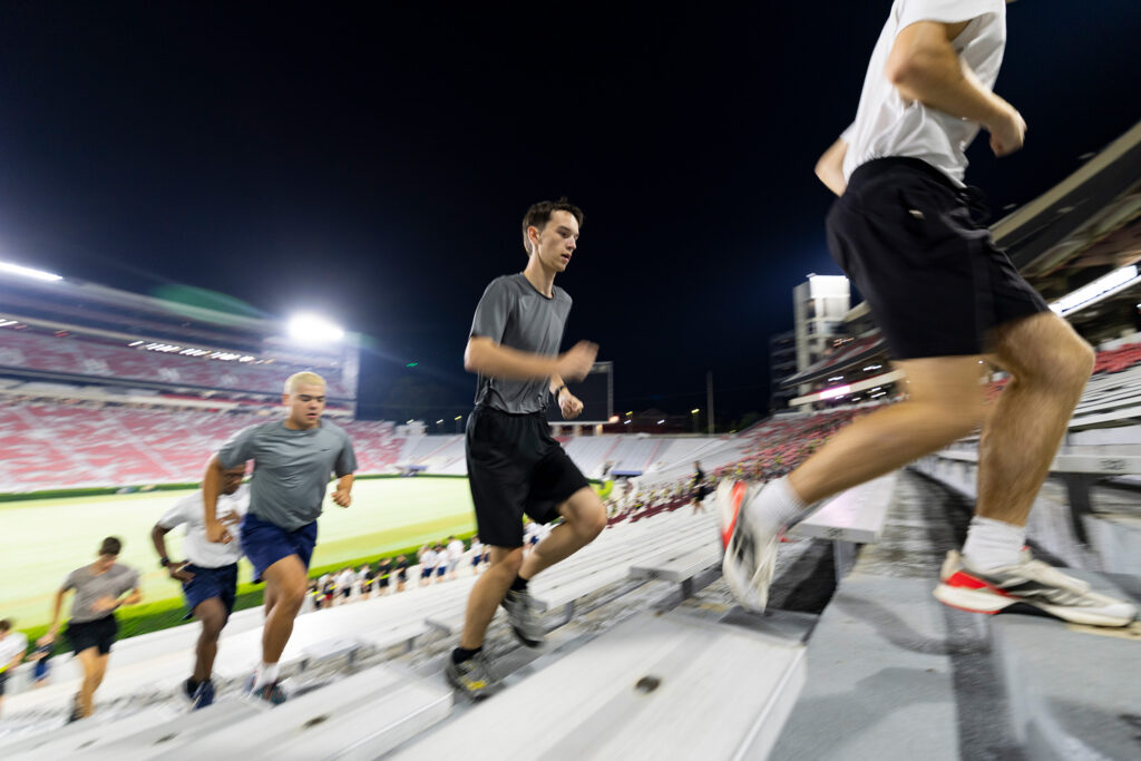 Air Force cadets sprint up the stairs.