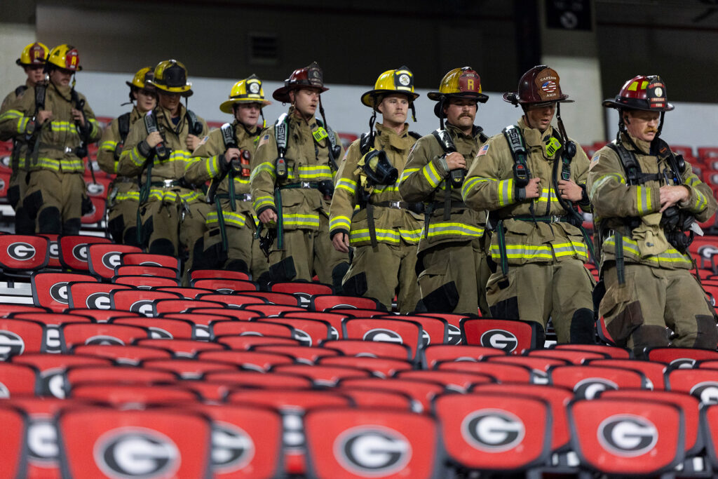Athens-Clarke County firefighters stroll down the stairway.