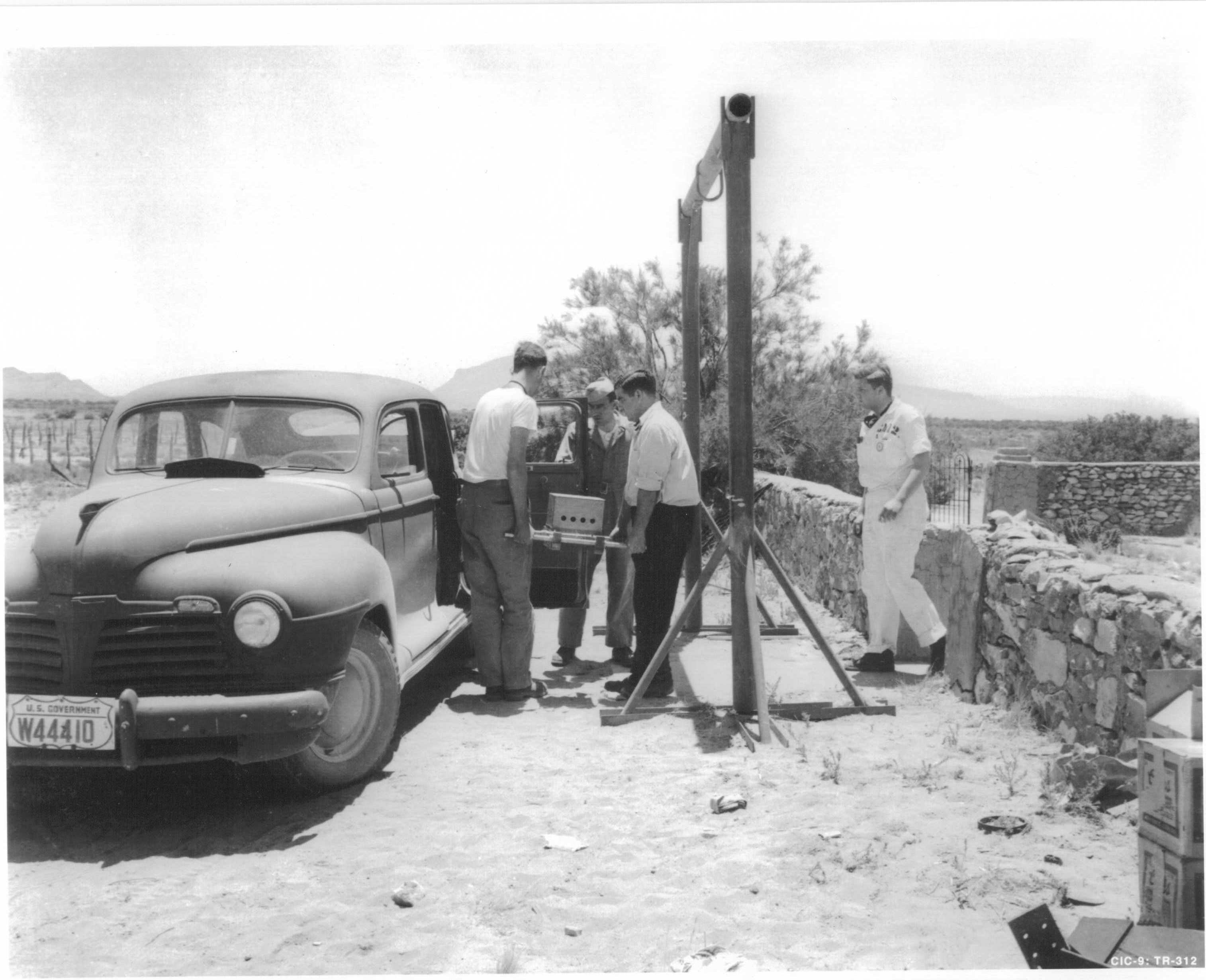 The bomb’s core is loaded into a vehicle at the Army-owned McDonald ranch house, where it was assembled, to be taken to the nearby firing tower at the test site.
