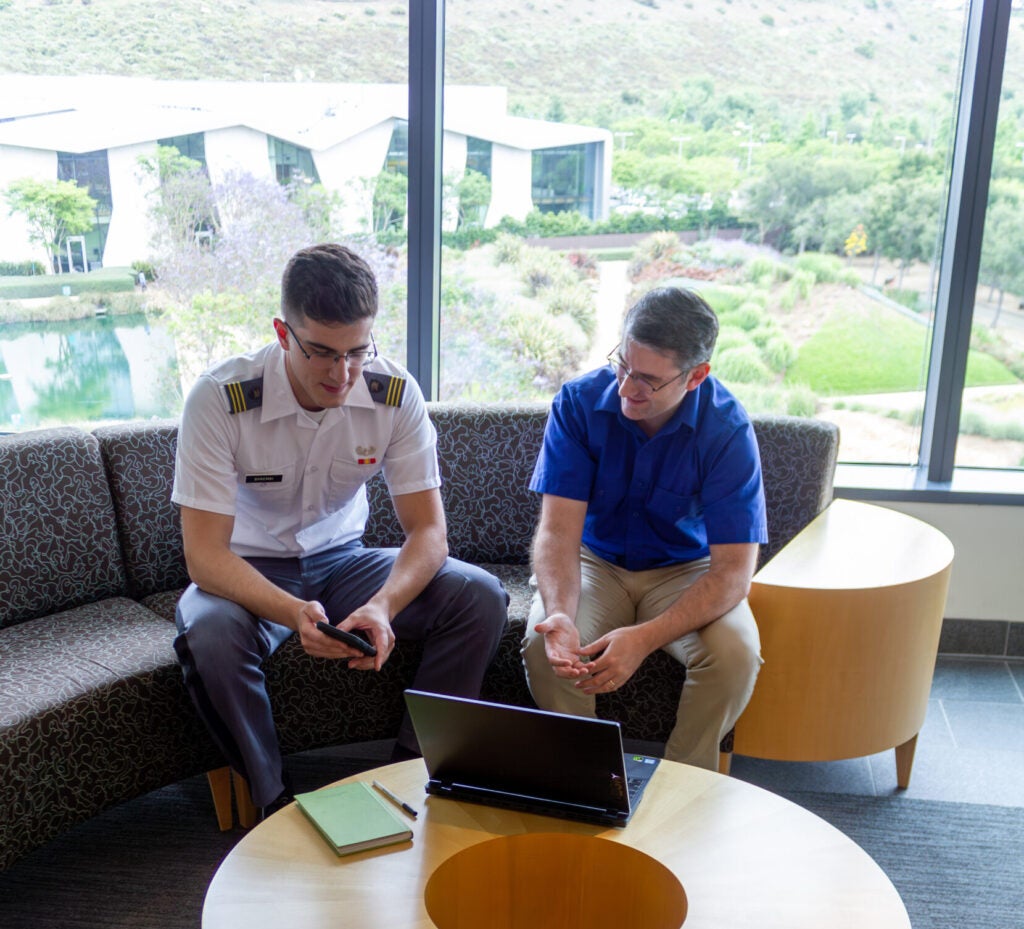 Benjamin Nye (depicted, right) is among the lead researchers at the Artificial Intelligence Research Center of Excellence for Education, a two-year, $4.5 million initiative financed by Congress that applies artificial intelligence to military education. (USC Photo: Courtesy of the USC Institute for Creative Technologies)