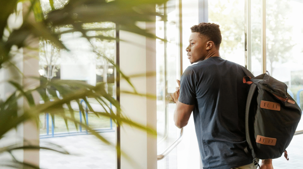 A young individual gazing out a window. Image credit: LinkedIn Sales Navigator, Pexels