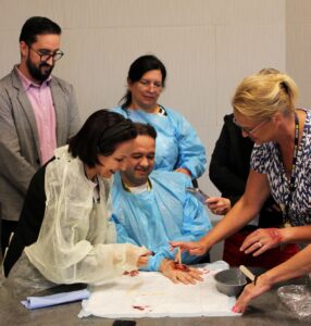 Participants collaborate to create a simulated wound. Image credit: Juan Ochoa