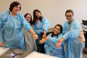 Participants display their simulated wounds. Image credit: Juan Ochoa