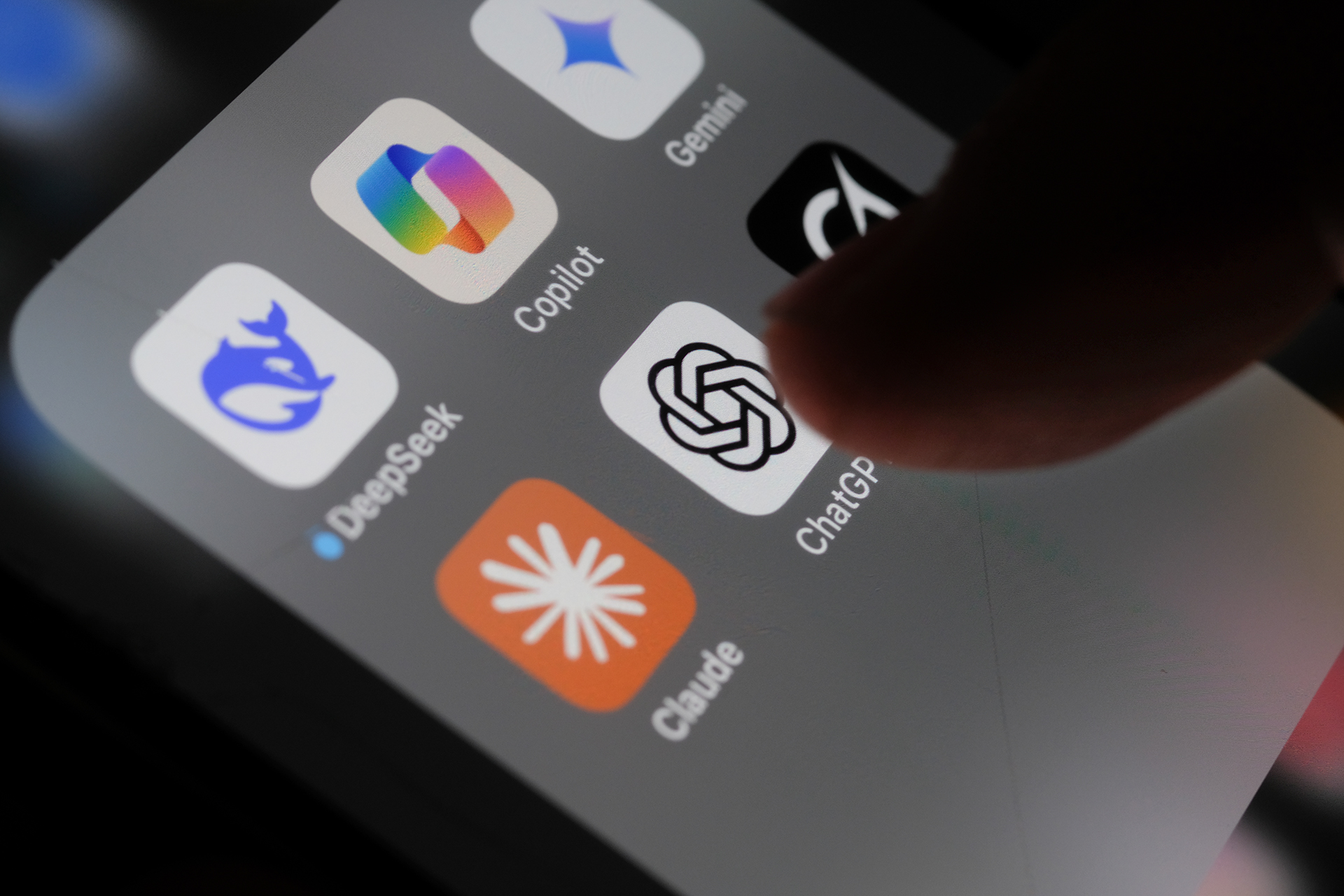 Individual interacts with an AI application on a smartphone.