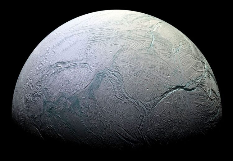 A close-up image showcasing the blue and white marbled surface of Enceladus.