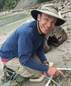 Jason toft, a scientist, working in the sand